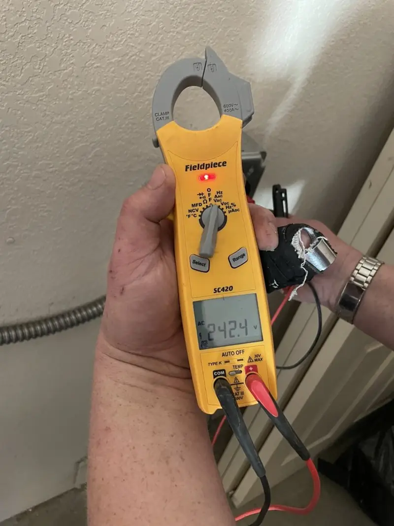 Voltage testing with clamp meter during Recessed Lighting Installation in Cheltenham
